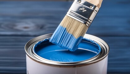paint brush and a blue paint can