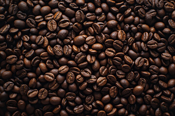 Obraz premium High resolution photograph of coffee beans, top view, close up shot. The texture and color of the background create an atmosphere reminiscent of an old dark room with warm tones