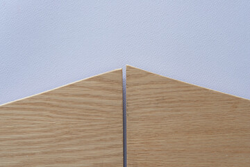 two cut wooden object on paper