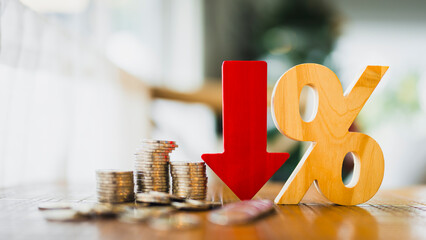 Percentage model, coin stack and down arrow, concepts for success, methods, systems of raising or lowering Fed interest rates to correct inflation concepts.