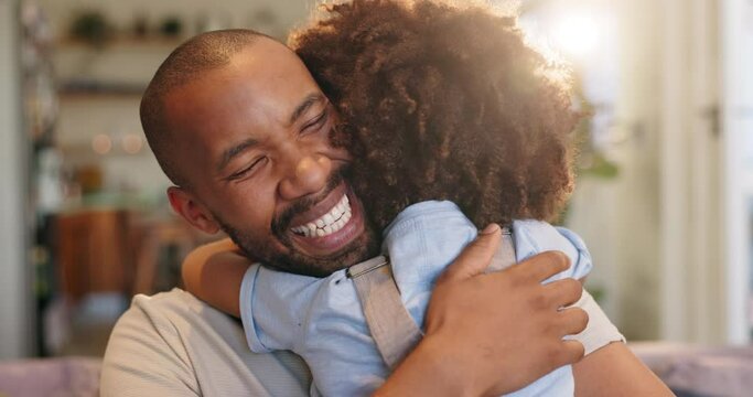 Happy, hugging and dad with child on sofa relaxing in living room for fathers day celebration. Smile, love and boy kid embracing black man on couch in lounge for bonding together at family home.