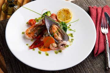 Salad with seafood in a plate.