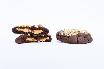 chocolate chip cookie with peanut butter on white background