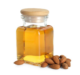 Bottle of almond oil and fresh nuts isolated on white