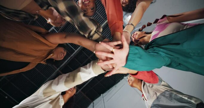 Hands, low angle and dancer women for collaboration, support or motivation in dance studio. Teamwork, diversity and young friends in huddle for competition, practice routine or united performance
