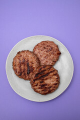Tasty grilled hamburgers meat on plate