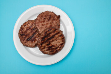 Tasty grilled hamburgers meat on plate