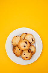 Freshly baked rusks with raisins, on small plate