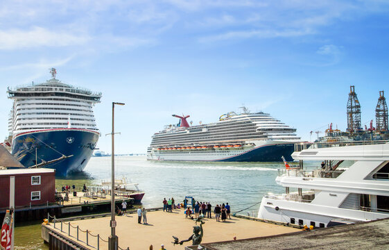 Galveston, USA - March 23, 2024: Cruise ships Carnival Jubilee docked  and Carnival Dream sailing from port Galveston a sunny day. The port is a popular Caribbean cruise destination