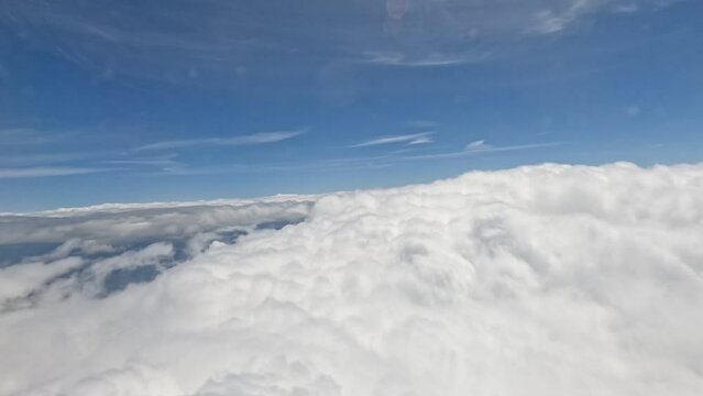 4k timelapse of an aircraft descending through clouds and landing at London Heathrow airport, UK