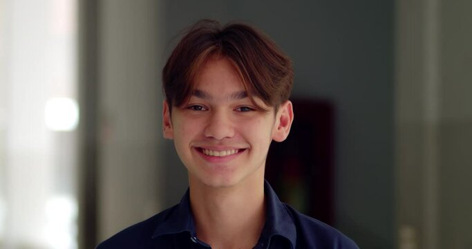 A happy smile of a handsome male high school student who is half Asian-European.