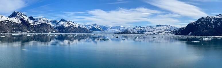 Panorama, Panoramic of Columbia Glaicer, snow covered mountains, and reflection in the water. A beautiful, calm, peaceful frozen landscape.