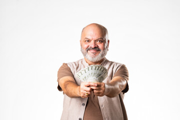 Indian asian senior retired old man holding money fan against white background