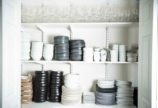 Set of plates, bowls, cups stacked 