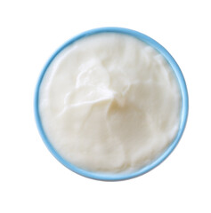 natural organic yogurt in a blue ceramic bowl isolated on a white background, top view.