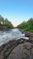a rocky mountain river somewhere in the Scandinavian forest