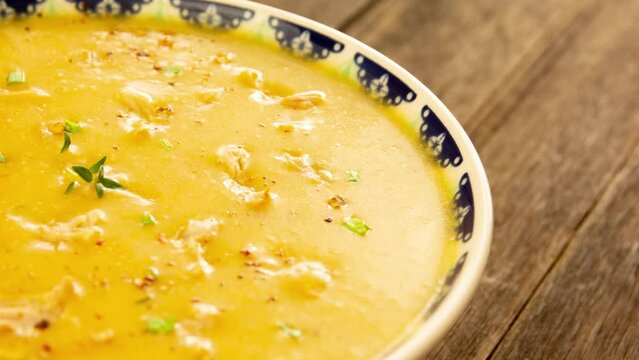 Manioc shredded chicken soup with fresh herbs and pepper