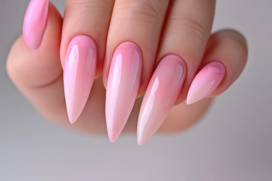 Elegant Gradient Pink Stiletto Nails with Glossy Finish and Stylish Manicure Design