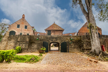 Entrance of Fort Zeelandia and colonial houses in Paramaribo, Suriname, South America