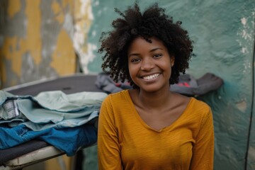 Fototapeta premium A happy woman standing in front of a lush green wall, with a warm and inviting smile