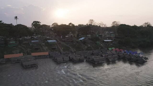 Aerial of lake or river water rafting, paddling on boat canal in park. Sightseeing in forest trees at Mae Sot ,Tak, Thailand. Nature landscape. Tourist adventure activity. Travel in vacation.