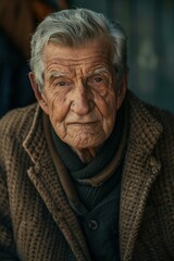 close-up portrait photo of stylish happy old man with modern haircut, big beard and well dressed.