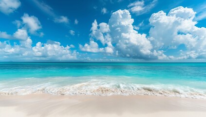 Obraz premium A tranquil beach scene featuring pristine white sand, crystal clear turquoise water, and a vast expanse of bright blue sky with fluffy white clouds.