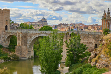 Arch Alcantara Bridge spanning the Tagus River in Toledo, Spain.