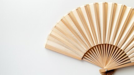 Wooden folding fans up close on white background top view with empty space