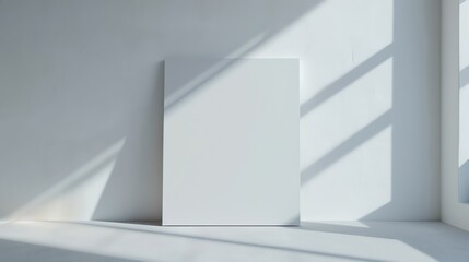 Obraz premium Simple white canvas with a subtle shadow cast by the product, creating depth and focus
