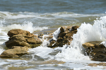 Waves crashing over coquina rocks on Florida's Palm Coast.
