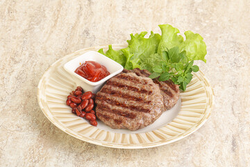 Grilled beef burger cutlet with sauce