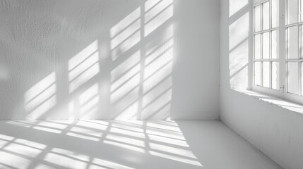 Fototapeta premium Sunlight casting geometric window shadows on a white wall, creating an abstract minimalist pattern of light and shadow, minimalist background with clean lines