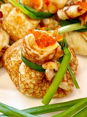 Pancakes crepes with red caviar.
