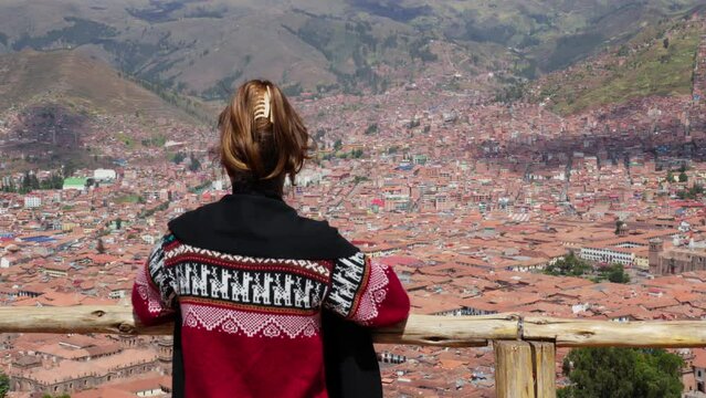 Young Woman Enjoying the Scenic View of Cusco, Peru. Young Caucasian Woman enjoying vacation