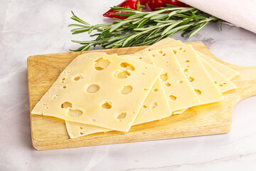 Sliced maasdam cheese with holes