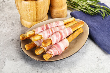 Crispy grissini italian bread with bacon