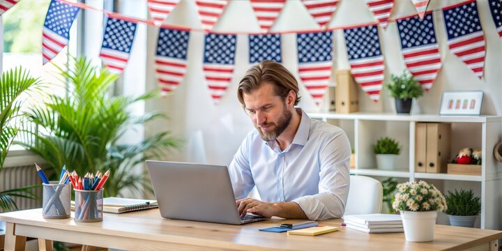 Man working on laptop in festive home office with American flag decorations