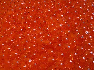 Red caviar salmon background.