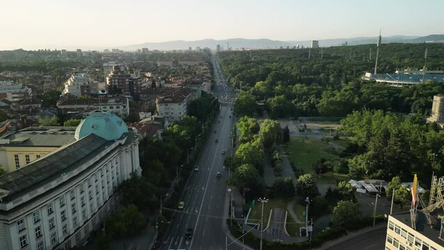 Aerial drone shot of the old town in Sofia, Bulgaria at sunrise. Eastern Europe. The city center buildings and boulevards as seen from above during sunrise.