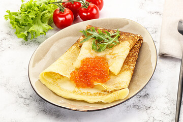 Russian pancake with red caviar