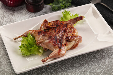 Grilled quail in the plate