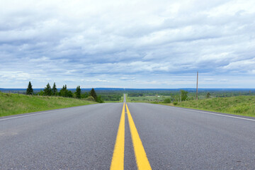 Scenic view from the highway with yellow solid lines in plains.