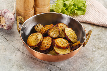 Baked red batat slices with herbs