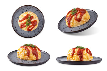 Omurice with ketchup sauce in a plate on a white isolated background