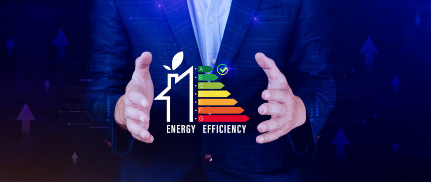 Energy efficiency concept, Businessman touching virtual screen of energy efficiency rating for energy efficient house building rate label audit, Renewable energy concept. - Powered by Adobe