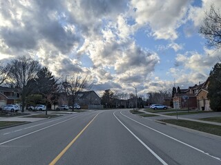 A Suburban Street on a cloudy day during sunset