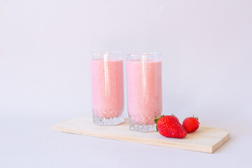 Strawberry fresh pink berry smoothie on the table