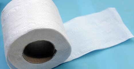 Toilet paper on blue background.