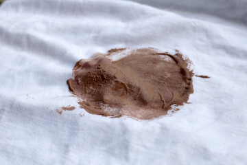 Dirty stain chocolate ice cream  on white clothes